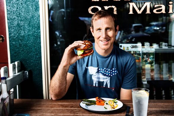 Beyond Meat CEO eating a plabt based burger